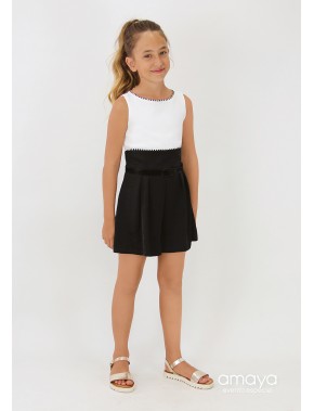 Mono corto de niña bicolor blanco y negro desmangado AMAYA, modelo 554620 Tallas de 8 a la 20. Alpi Moda Infantil Valladolid